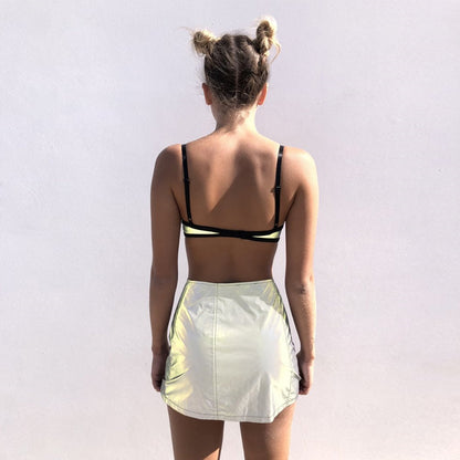 Fashionable sexy lady slim buttocks short reflective skirt