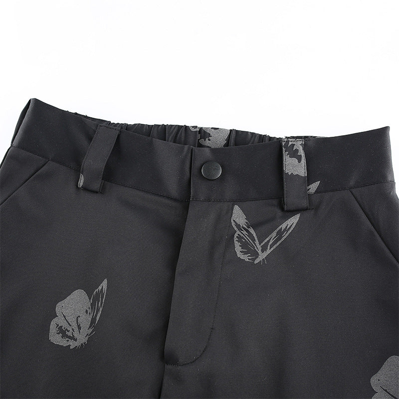 Pantalón deportivo con estampado reflectante de mariposas