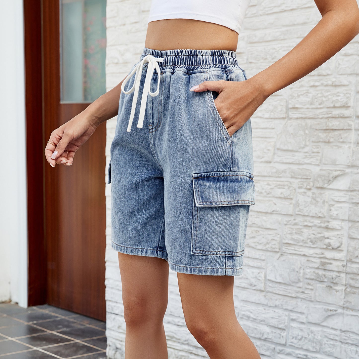 Vêtements pour femmes printemps été lavé noué taille élastique cinq points short en Denim