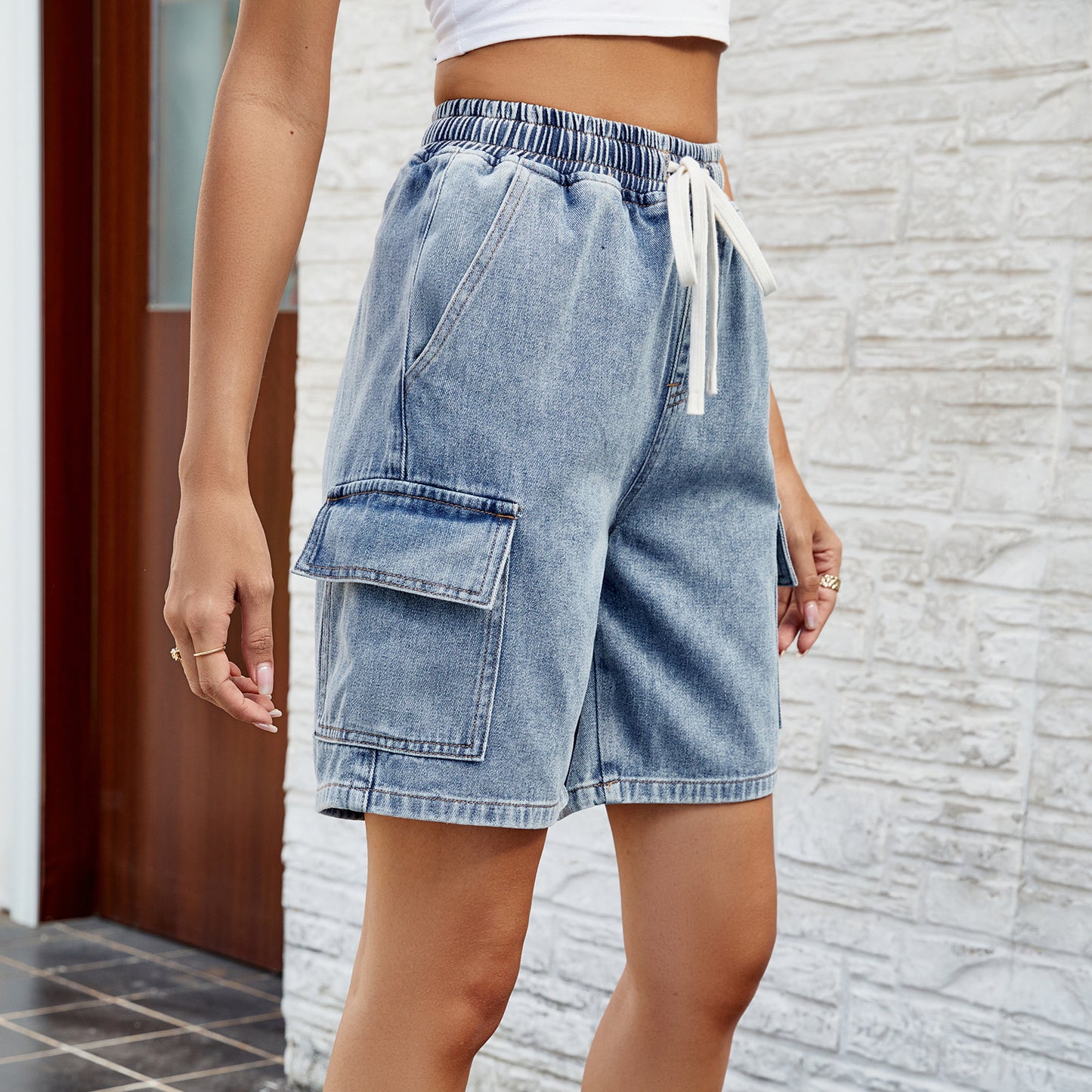 Vêtements pour femmes printemps été lavé noué taille élastique cinq points short en Denim