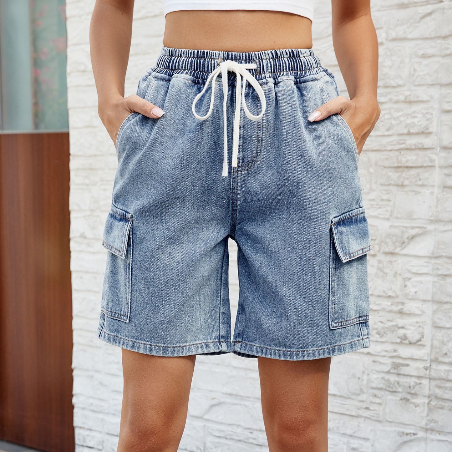 Vêtements pour femmes printemps été lavé noué taille élastique cinq points short en Denim